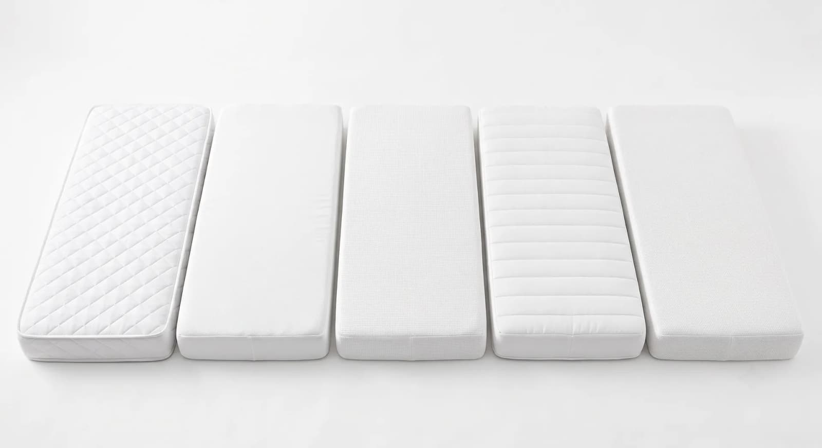 Four slim white twin mattresses arranged side by side on a white background